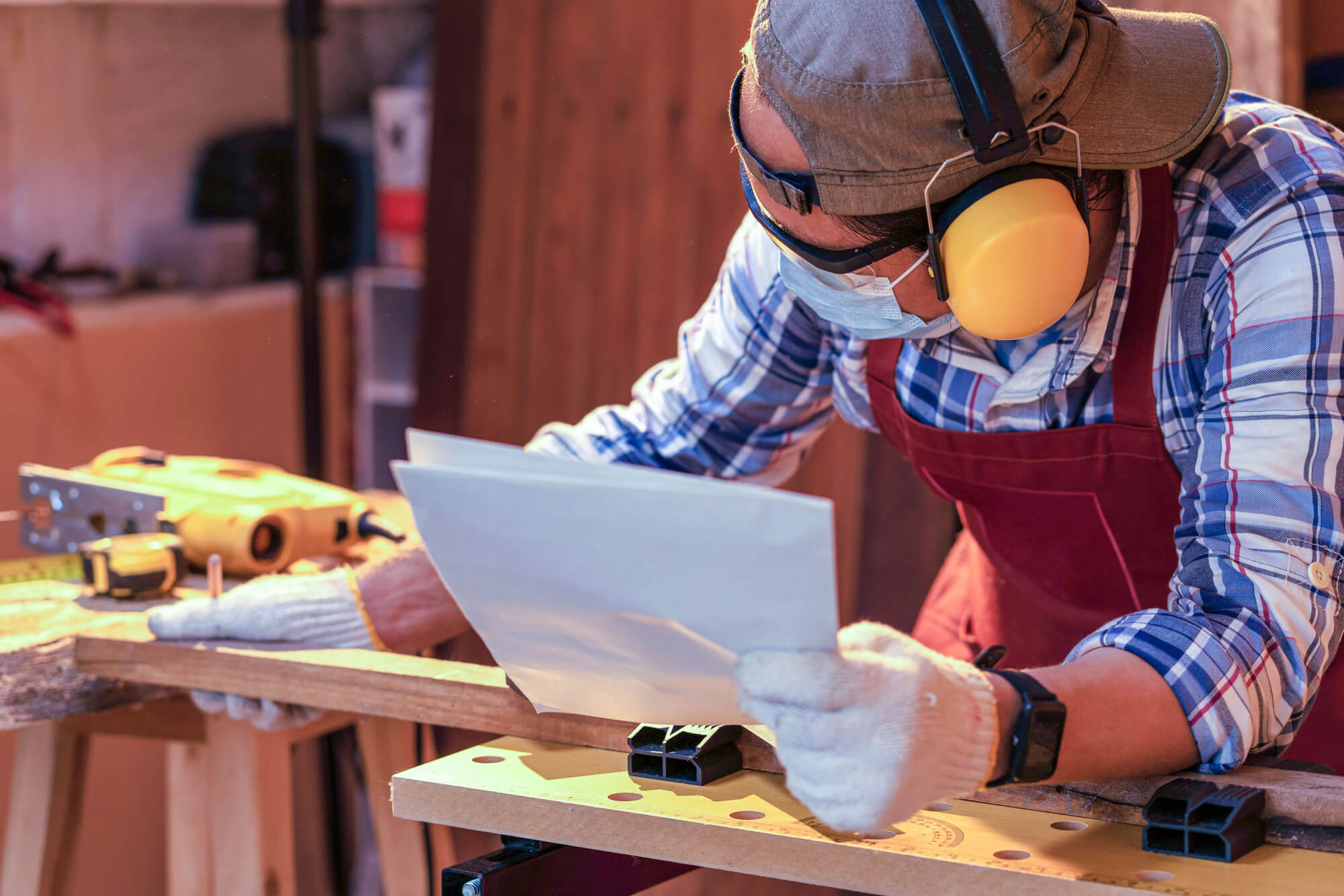 Trade worker using tools.