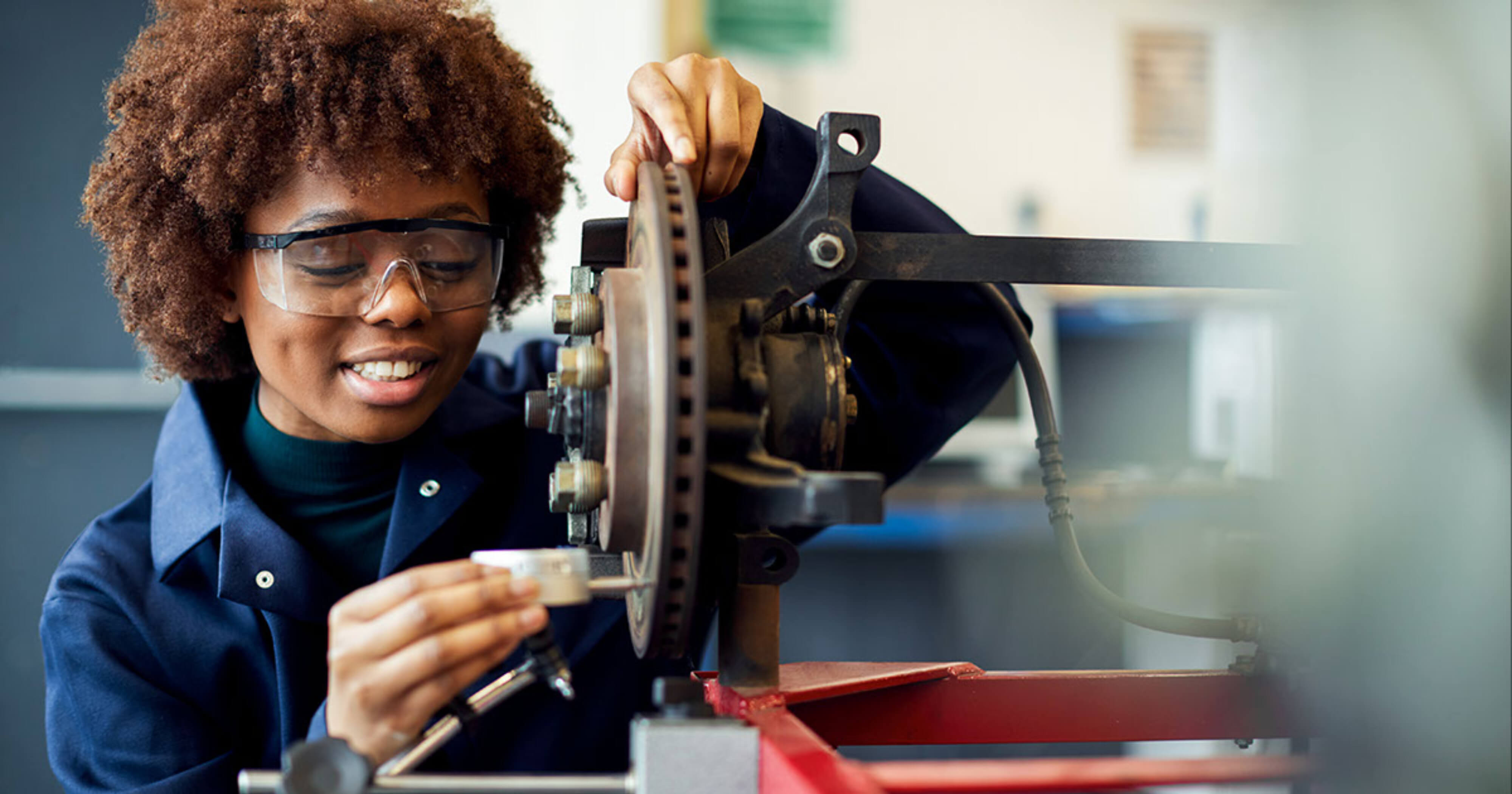 Trade worker using a tool.